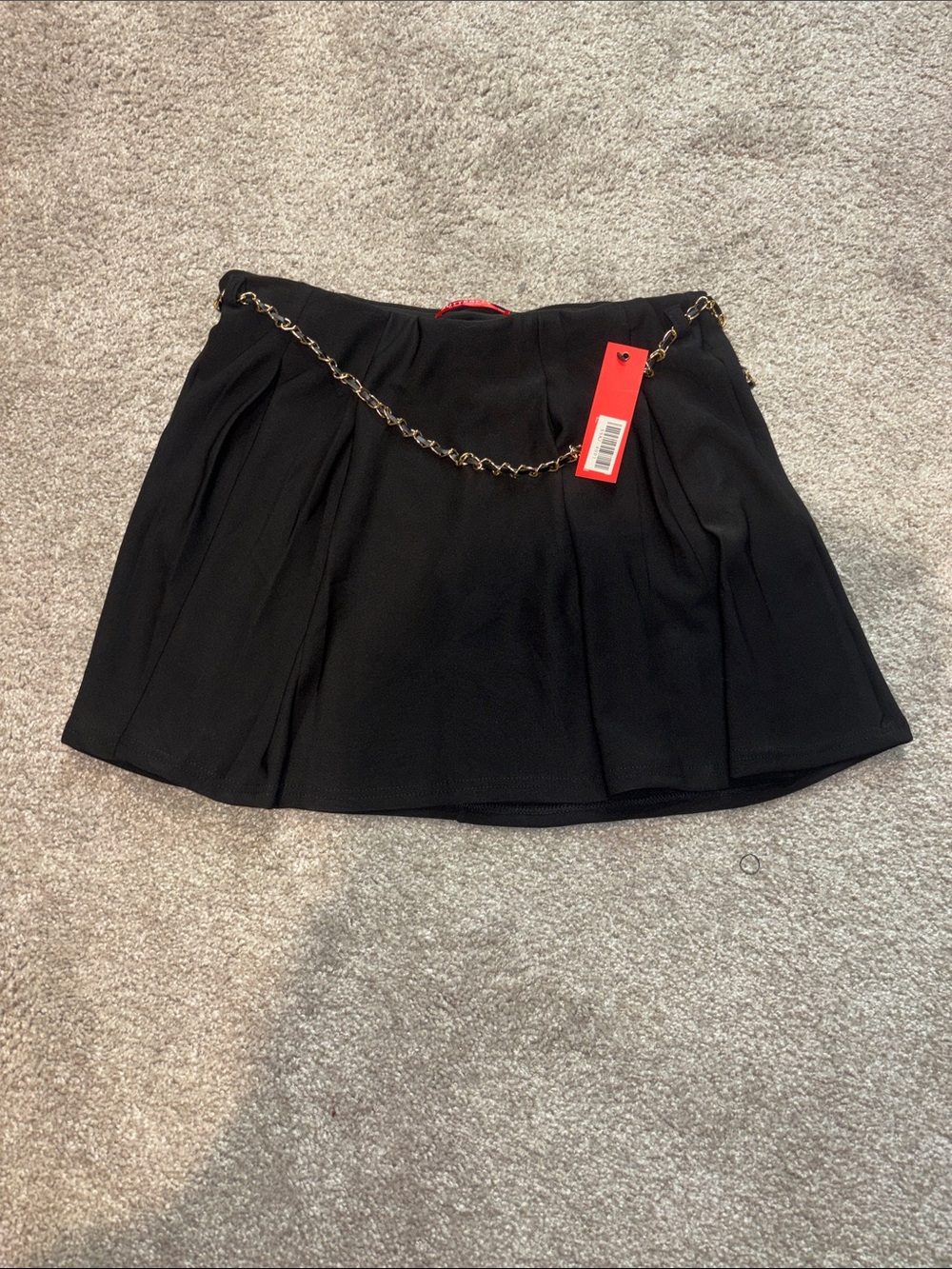 Black Pleated Mini Skirt with Gold Chain Accent